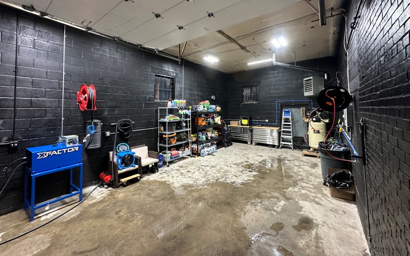 A view inside our the Norwalk, CT detailing shop. Showcases the long space and efficient work-flow