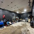 A view inside our the Norwalk, CT detailing shop. Showcases the long space and efficient work-flow