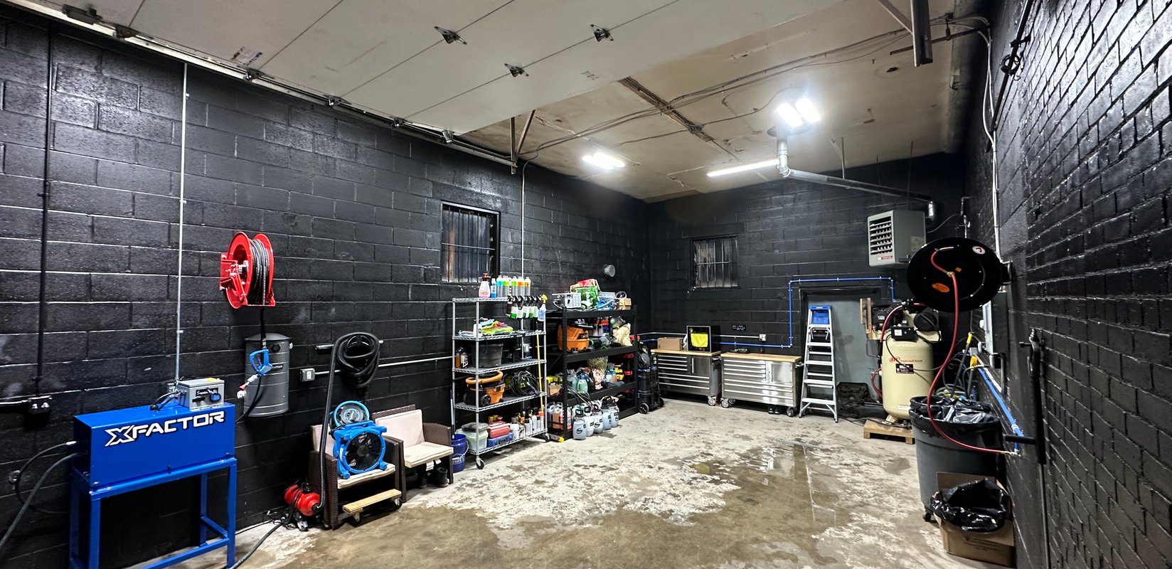 A view inside our the Norwalk, CT detailing shop. Showcases the long space and efficient work-flow