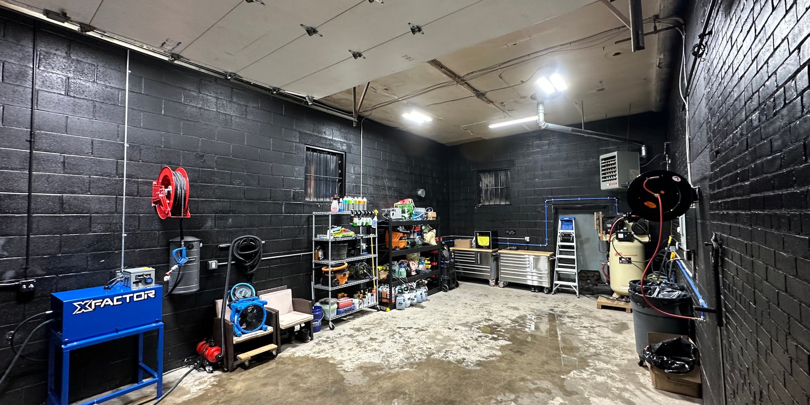 A view inside our the Norwalk, CT detailing shop. Showcases the long space and efficient work-flow